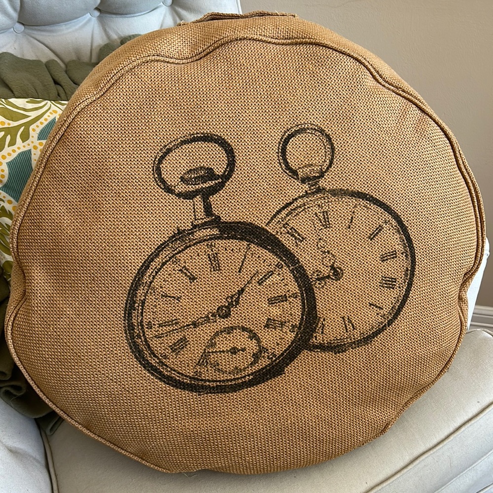 Round burlap decorative pillow.